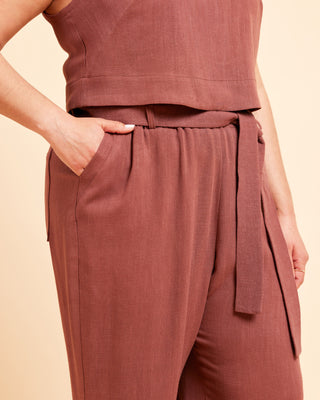 Brown sleeveless top and pants set on a beige background. These pants are the Everett Pants & Shorts sewing pattern from Cashmerette.