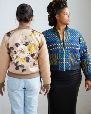 Two women wearing patterned jackets against a plain background. This jacket is the Cashmerette Club Kimball Bomber Jacket sewing pattern.