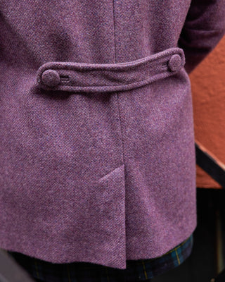 Close-up of a purple coat with a belt, focusing on the waist area. This coat is the Newcomb Car Coat sewing pattern from Cashmerette.