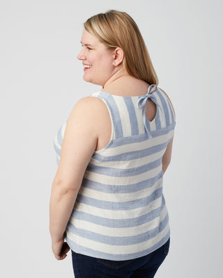 Woman wearing a blue and white striped tank top on a plain background. This is a pattern hack of the Springfield Top from the Pattern Hacking for Curves class.