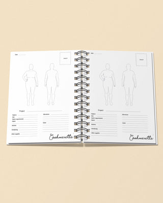 Open notebook with fashion design templates and 'Cashmerette' branding on a beige background