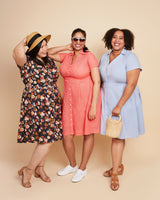 Three women wearing dresses in different colors posing against a beige background. This dress is the Lenox Shirtdress sewing pattern from Cashmerette.