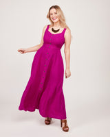 Woman wearing a long purple dress with buttons on a white background. This is the Holyoke Maxi Dress & Skirt sewing pattern from Cashmerette.