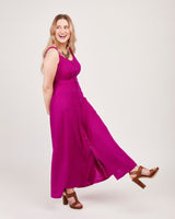 Woman wearing a bright pink dress on a white background. This is the Holyoke Maxi Dress & Skirt sewing pattern from Cashmerette.