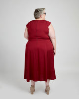 Person wearing a red dress on a white background. This dress is the Upton Dress & Skirt sewing pattern from Cashmerette.
