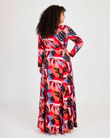 Woman wearing a colorful patterned dress on a white background. This dress is the Upton Dress & Skirt sewing pattern from Cashmerette.