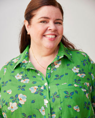 Person wearing a green floral shirt against a plain background. This dress is the Winvale Dress & Tunic sewing pattern from Cashmerette.