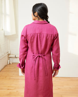Person wearing a pink dress standing in a room with wooden floor and white walls. This dress is the Winvale Dress & Tunic sewing pattern from Cashmerette.