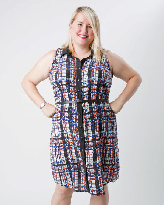 Woman wearing a plaid dress on a white background. This dress is the Harrison Shirtdress sewing pattern from Cashmerette.