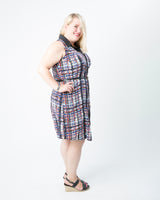 Woman wearing a plaid dress on a white background. This dress is the Harrison Shirtdress sewing pattern from Cashmerette.