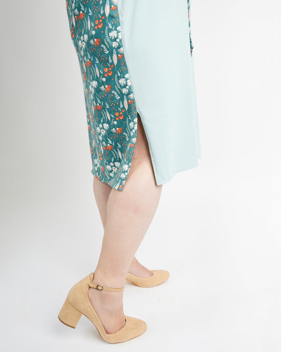 Person wearing a floral skirt and beige sandals on a white background. This is the Pembroke Dress & Tunic sewing pattern from Cashmerette.