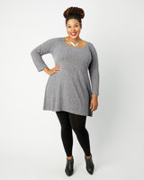 Woman wearing a gray dress on a white background. This dress is the Washington Dress sewing pattern from Cashmerette.