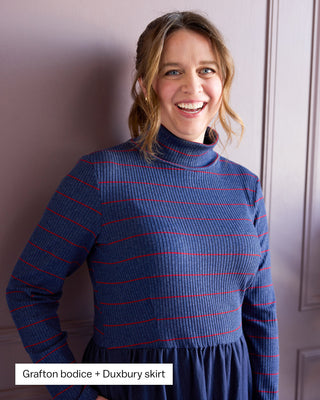 Woman wearing a blue and red striped sweater with text 'Grafton bodice + Duxbury skirt' on a plain background. This is the Duxbury Dress sewing pattern from Cashmerette.