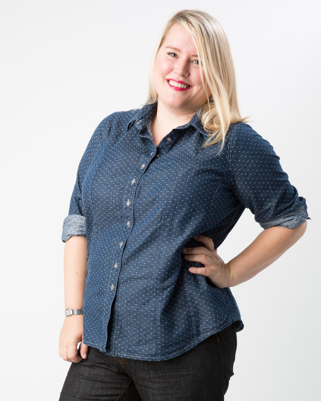Woman wearing a blue patterned shirt on a white background. This button-up shirt is the Harrison Shirt sewing pattern from Cashmerette.