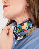 Person wearing a floral-patterned choker on a plain background. This button-up shirt is the Harrison Shirt sewing pattern from Cashmerette.