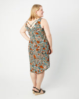 Woman wearing a floral dress on a white background. This dress is the Webster Dress & Tunic sewing pattern from Cashmerette.