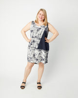 Woman wearing a black and white patterned dress on a white background. This top is the Webster Dress & Tunic sewing pattern from Cashmerette.