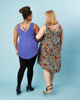 Two women wearing sleeveless tops with floral and solid designs on a light blue background. This is the Webster Dress & Tunic sewing pattern from Cashmerette.
