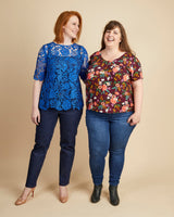 Two women wearing colorful tops and jeans on a beige background. This top is the Montrose Top sewing pattern from Cashmerette.