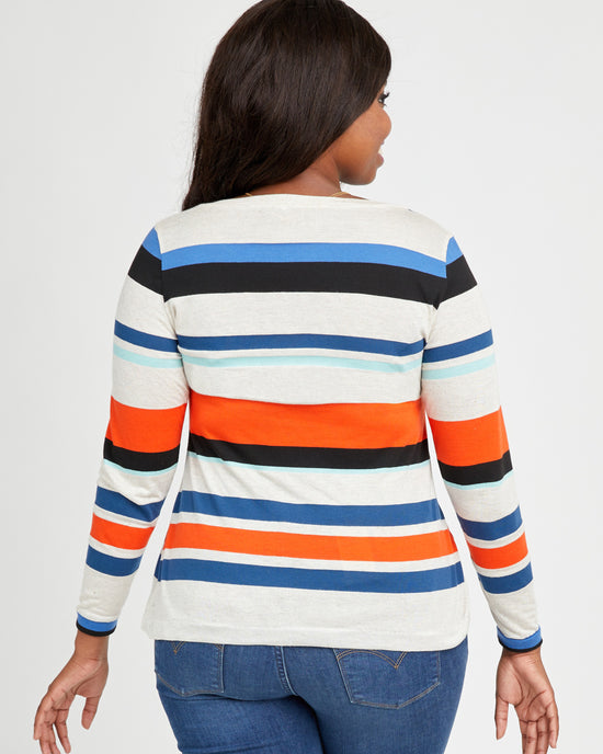 Woman wearing a striped long-sleeve shirt with a white background. This t-shirt is the Concord T-Shirt sewing pattern from Cashmerette.