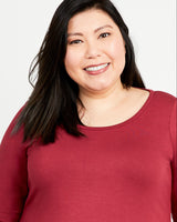 Woman wearing a red shirt against a white background. This t-shirt is the Concord T-Shirt sewing pattern from Cashmerette.