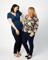 Two women wearing navy tops and dark jeans against a white background. This top is the Dartmouth Top sewing pattern from Cashmerette.