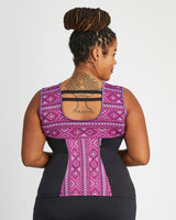 Person wearing a black and purple patterned athletic top on a white background. This top is the Spruce Workout Tank sewing pattern from Cashmerette.