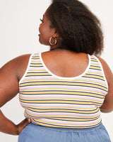 Woman wearing a striped tank top with a plain background. This tank top is the Saybrook Tank sewing pattern from Cashmerette.