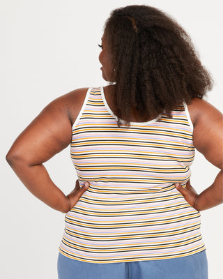 Woman wearing a striped tank top with her hands on her hips against a white background. This tank top is the Saybrook Tank sewing pattern from Cashmerette.