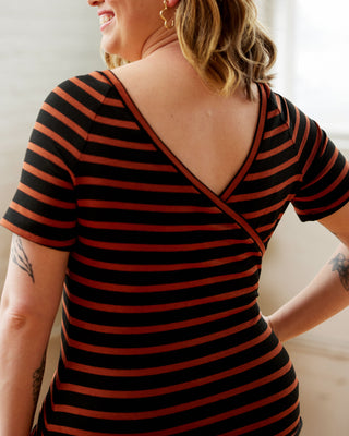 Person wearing a black and red striped dress with a deep neckline. This top is the Kenwin Raglan T-Shirt sewing pattern from Cashmerette.