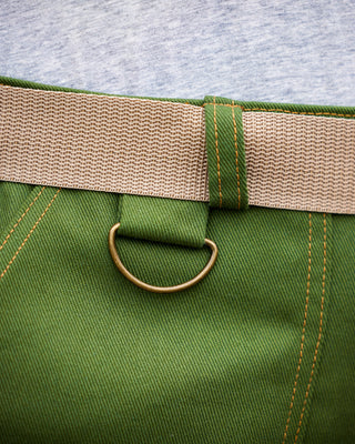 Close-up of a green pants with a beige belt and metal ring. These pants are the Esmond Cargo Pants sewing pattern from Cashmerette.