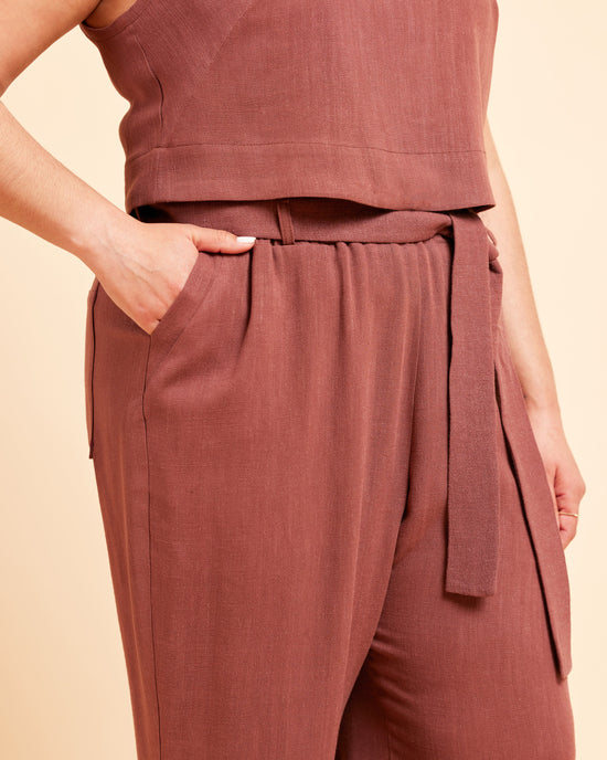 Brown sleeveless top and pants set on a beige background. These pants are the Everett Pants & Shorts sewing pattern from Cashmerette.