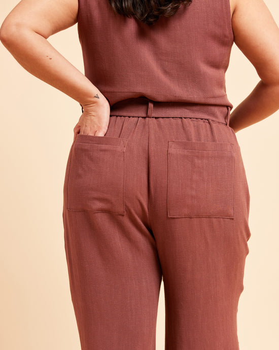 Person wearing a matching brown top and pants on a beige background. These pants are the Everett Pants & Shorts sewing pattern from Cashmerette.