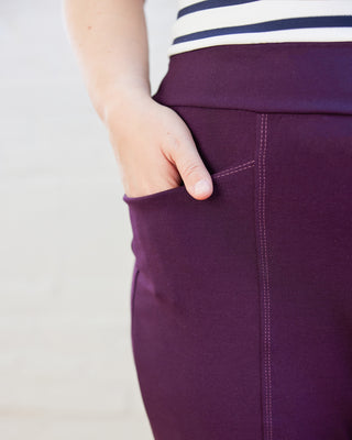 Close up of purple pants with a white background.These pants are the Ashwood Pants sewing pattern from Cashmerette.