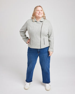 Person wearing a gray jacket and blue jeans on a white background. This biker jacket is the Canton Moto Jacket sewing pattern from Cashmerette.