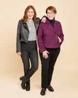 Two women wearing jackets against a beige background. This biker jacket is the Canton Moto Jacket sewing pattern from Cashmerette.