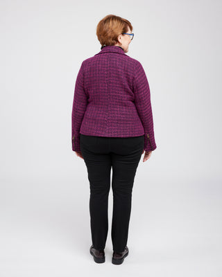 Person wearing a purple quilted jacket on a white background. This biker jacket is the Canton Moto Jacket sewing pattern from Cashmerette.