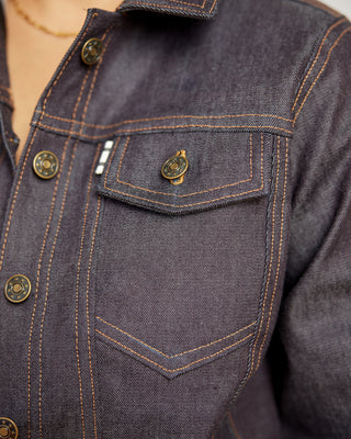 Close-up of a dark denim jacket with button details. This jacket is the Glover Jean Jacket sewing pattern from Cashmerette.