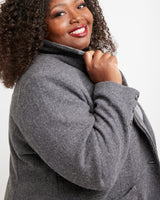 Woman wearing a gray coat against a white background. This blazer is the Auburn Blazer sewing pattern from Cashmerette.