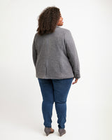 Person wearing a gray blazer and blue jeans on a white background. This blazer is the Auburn Blazer sewing pattern from Cashmerette.