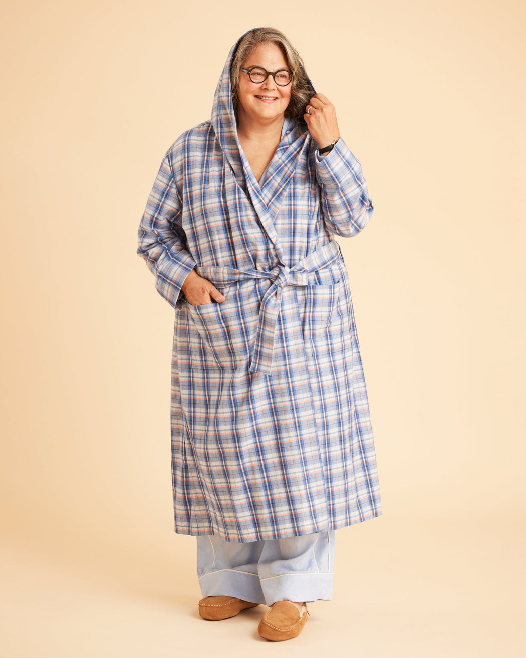 Person wearing a blue plaid robe on a beige background. This is the Fiske Sleepwear Set sewing pattern from Cashmerette.