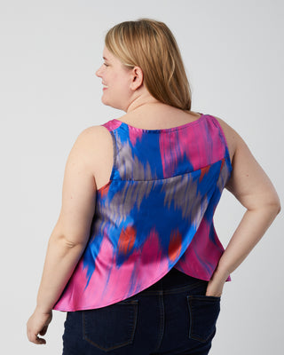 Woman wearing a colorful sleeveless top against a plain background. This is a pattern hack of the Springfield Top from the Pattern Hacking for Curves class.