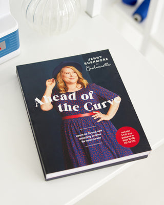 Book titled 'Ahead of the Curve' by Jenny Rushmore on a white surface