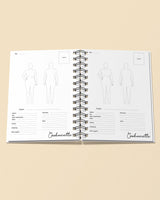 Open notebook with fashion design templates and 'Cashmerette' branding on a beige background