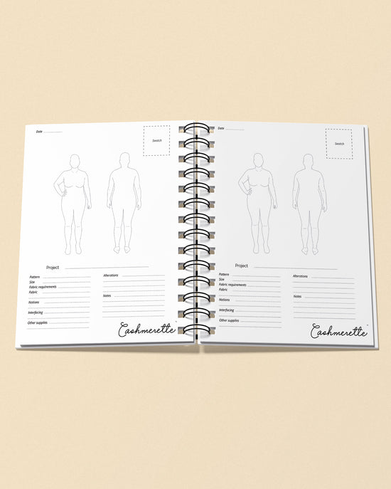Open notebook with fashion design templates and 'Cashmerette' branding on a beige background