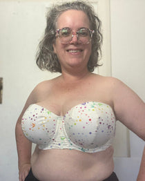 Person wearing a colorful strapless bra indoors. This is the Symmes Strapless Bra sewing pattern from Cashmerette.
