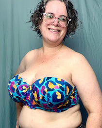 Person wearing a colorful strapless top against a plain background. This is the Symmes Strapless Bra sewing pattern from Cashmerette.