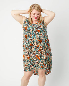 Woman wearing a floral dress on a white background